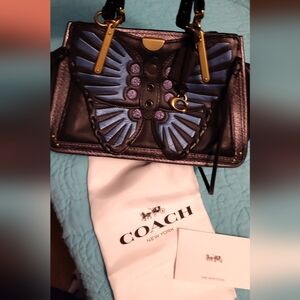 Elegant Black and Blue Shoulder Bag with Decorative Design